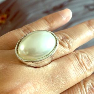 Costume jewelry ring. With white pearly stone